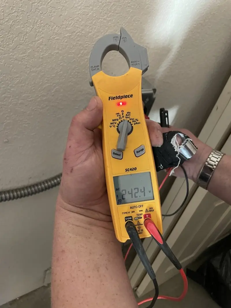 Voltage testing with clamp meter during Generator Installation in Stepping Stone